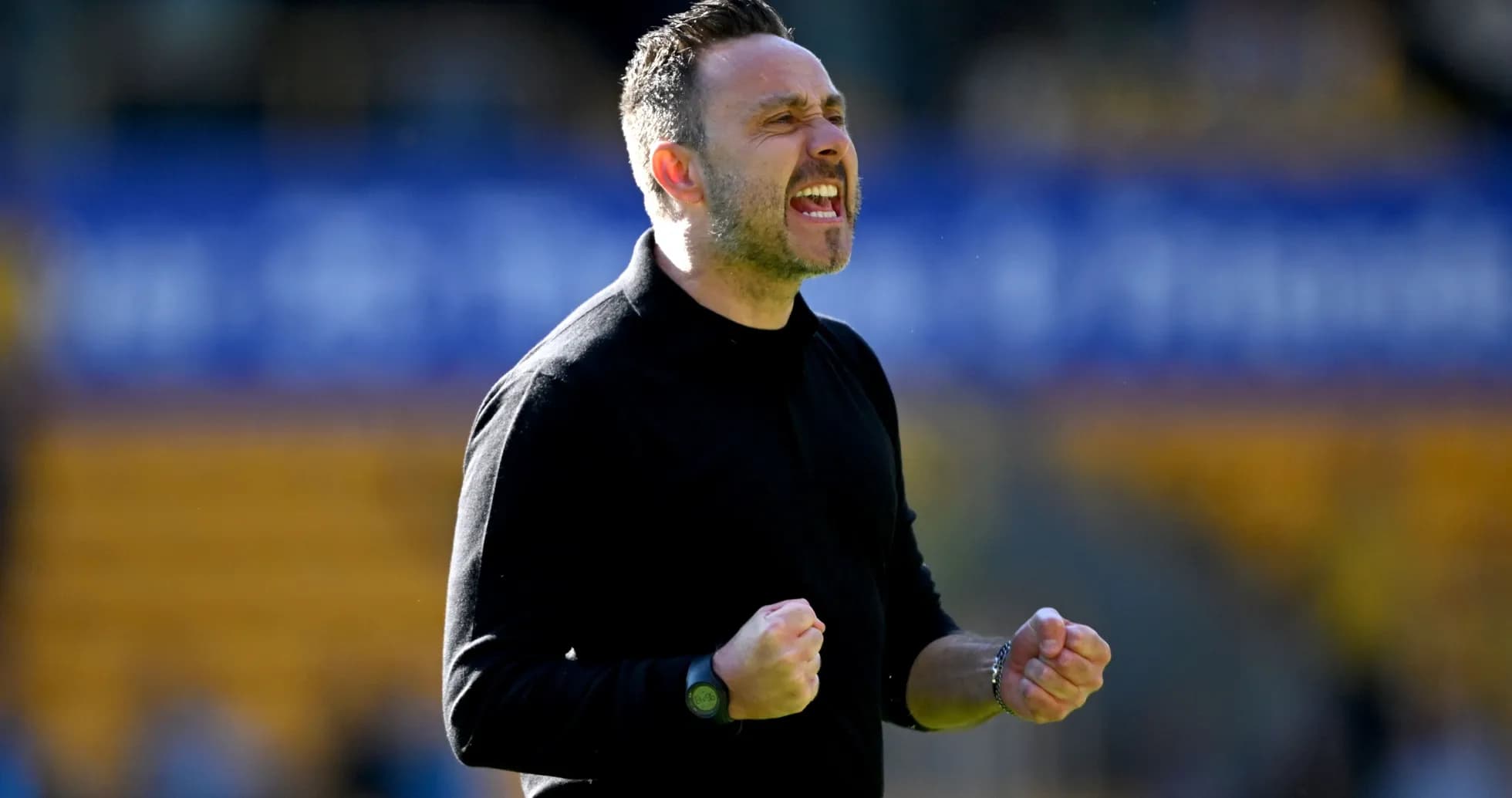 Manager celebrating on the sidelines during match
