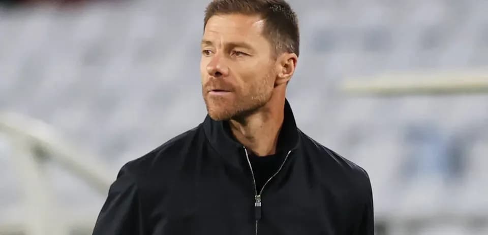 Coach observing players during a training session