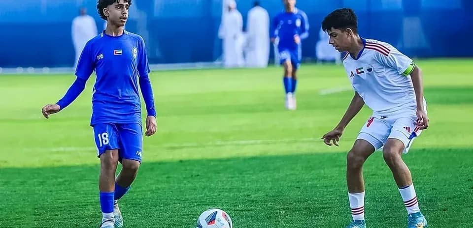 Two players competing in Al Nasr U23 match