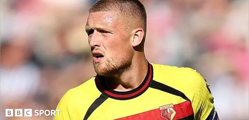 Player in Watford jersey during match action