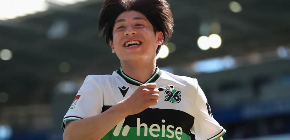 Player celebrating a goal with a joyful expression