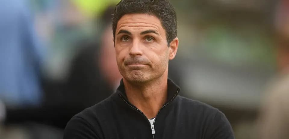 Coach observing from the sidelines during match