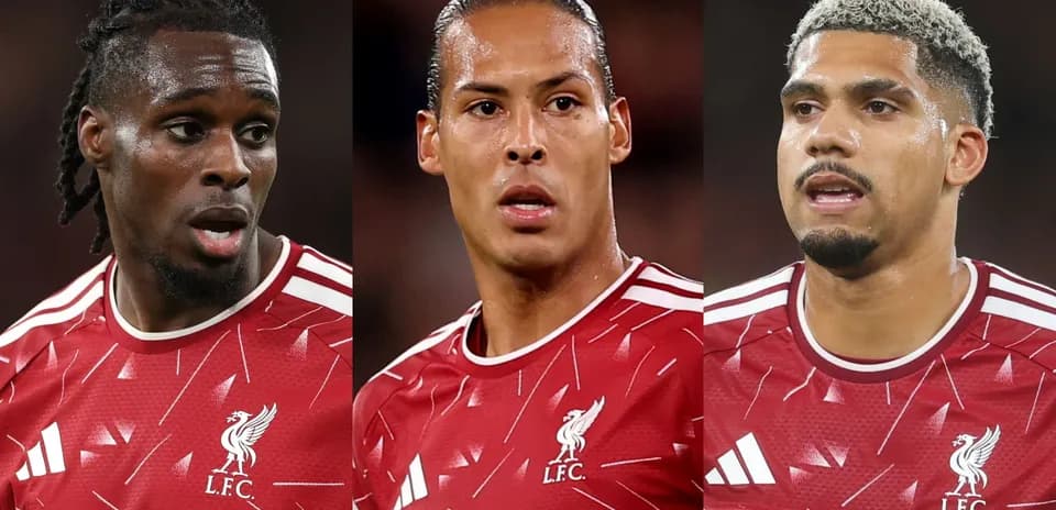 Three Liverpool players in red kits during match