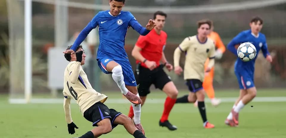 Player from Chelsea evading a tackle during match