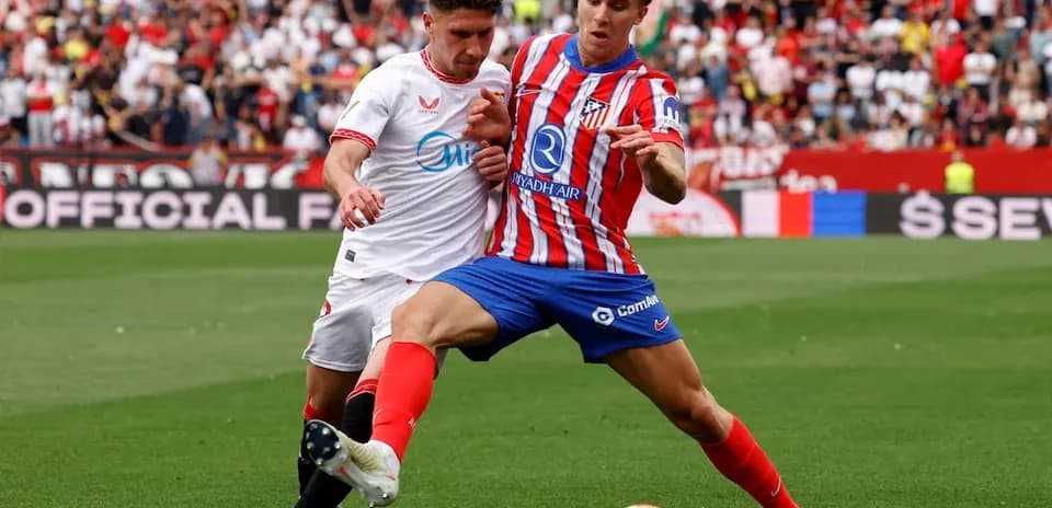 Sevilla and Atletico Madrid players competing for the ball