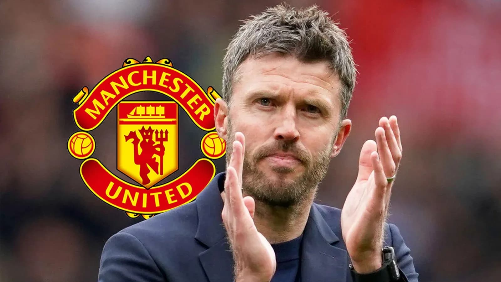 Coach applauding with Manchester United logo in background