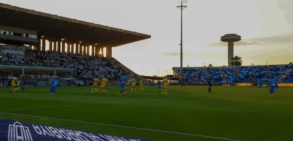 Players in blue and yellow during a soccer match
