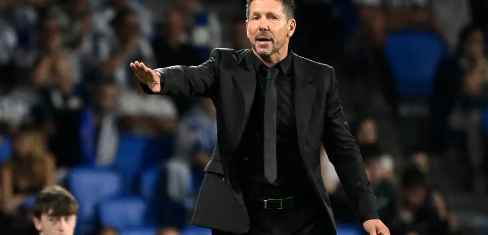 Coach giving instructions on the sidelines during match