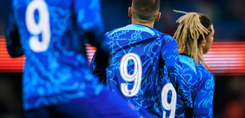 Players in blue jerseys with number 9 on back