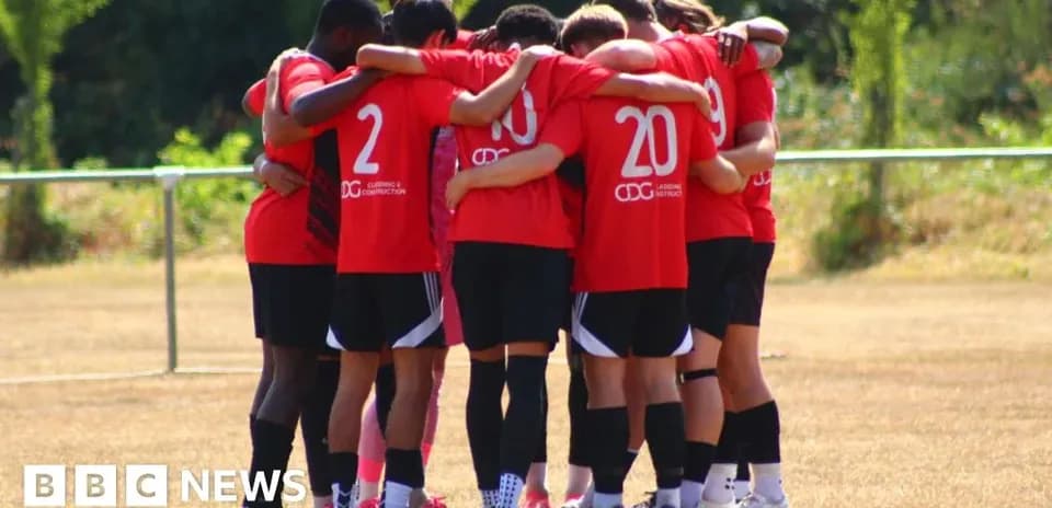 Team huddled together on the training field