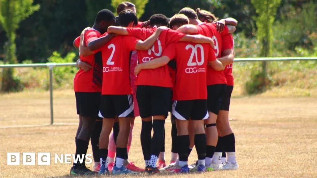 Team huddled together on the training field