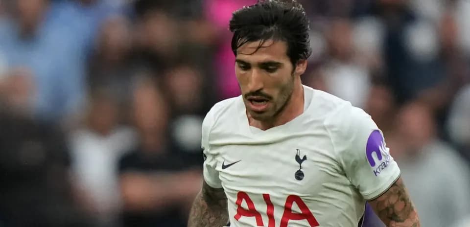 Player running with ball during match for Tottenham