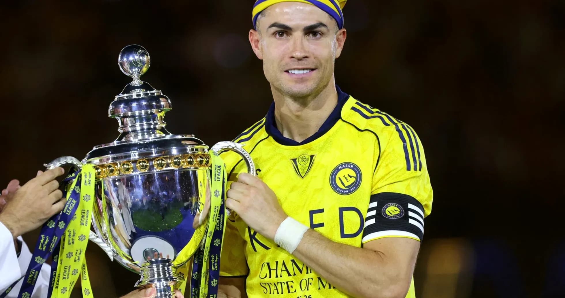 Player holding trophy after winning championship match