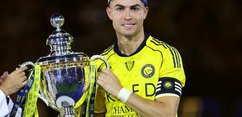 Player holding trophy after winning championship match