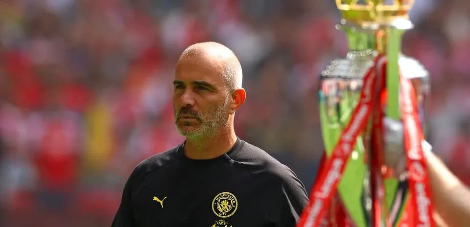 Coach walking past trophy during presentation ceremony