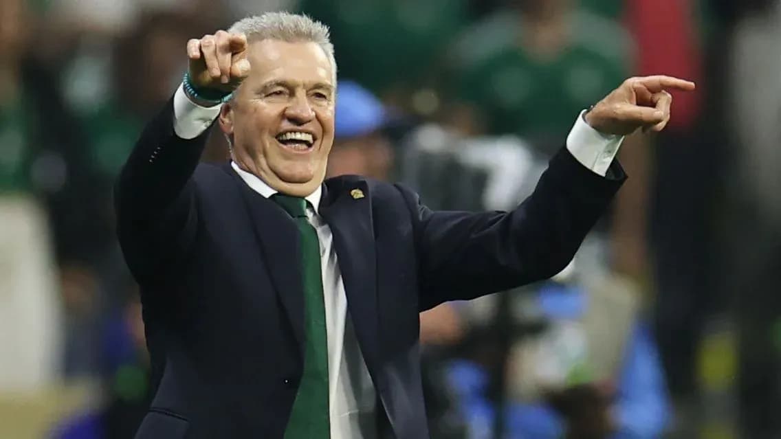 Coach celebrating and directing players on field