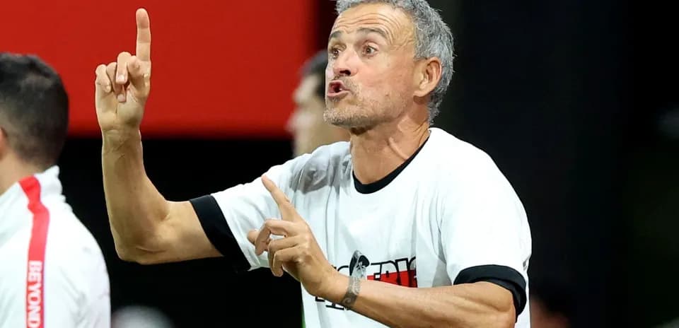 Coach gesturing passionately during a match
