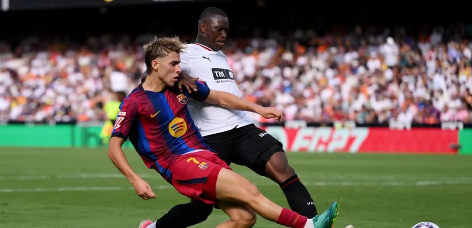 Player tackling opponent during a football match