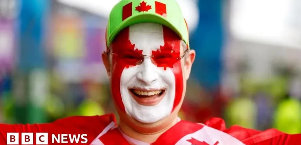 Fan celebrating with face paint and hat at event