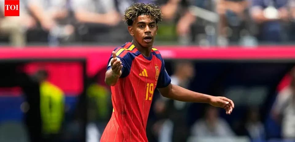 Player in Spain kit gesturing during match