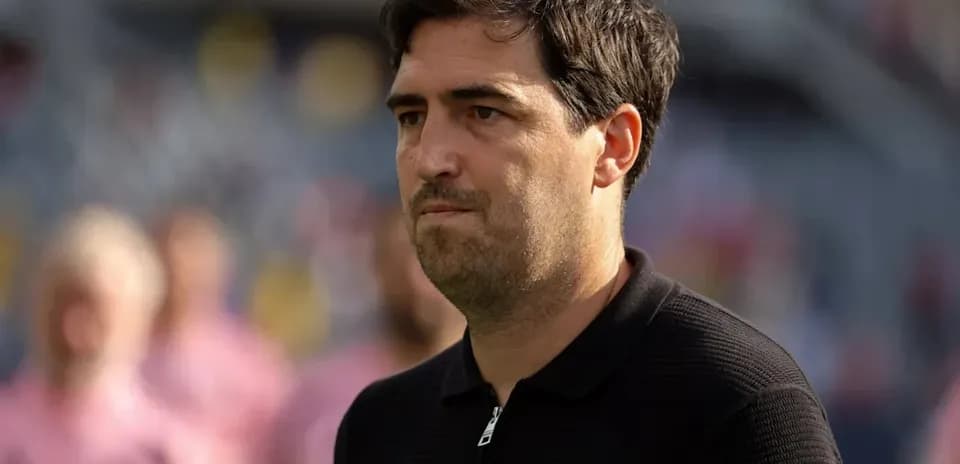 Coach observing the match from the sideline