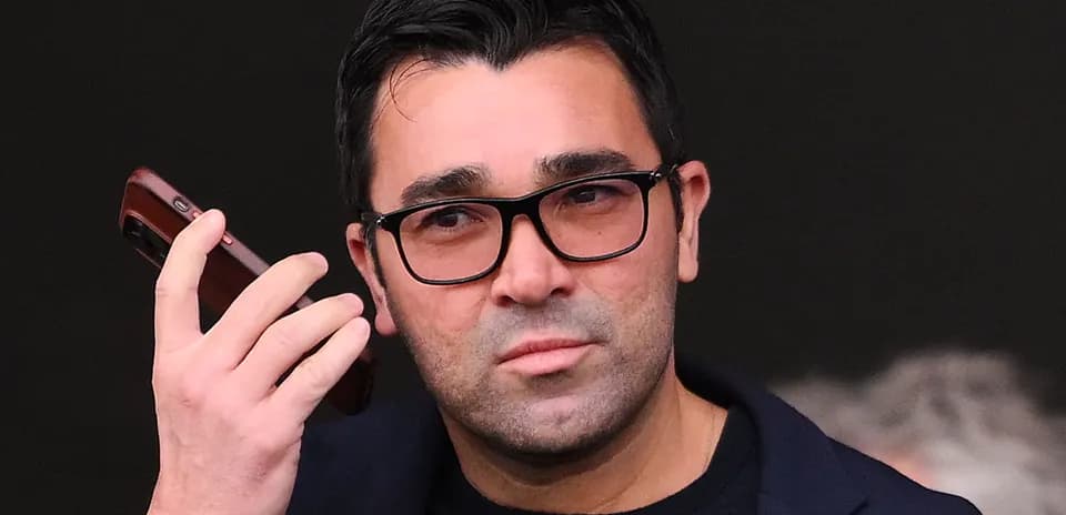 Person holding a phone and looking intently