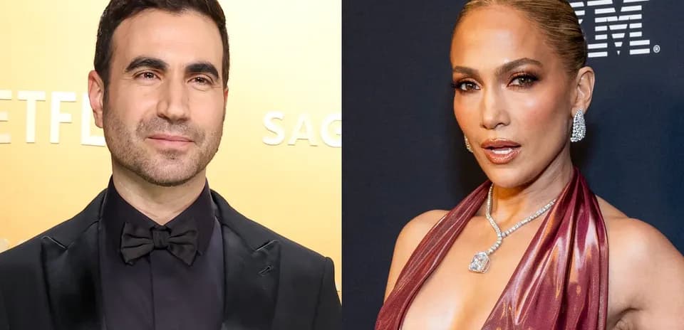 Two celebrities posing on red carpet event