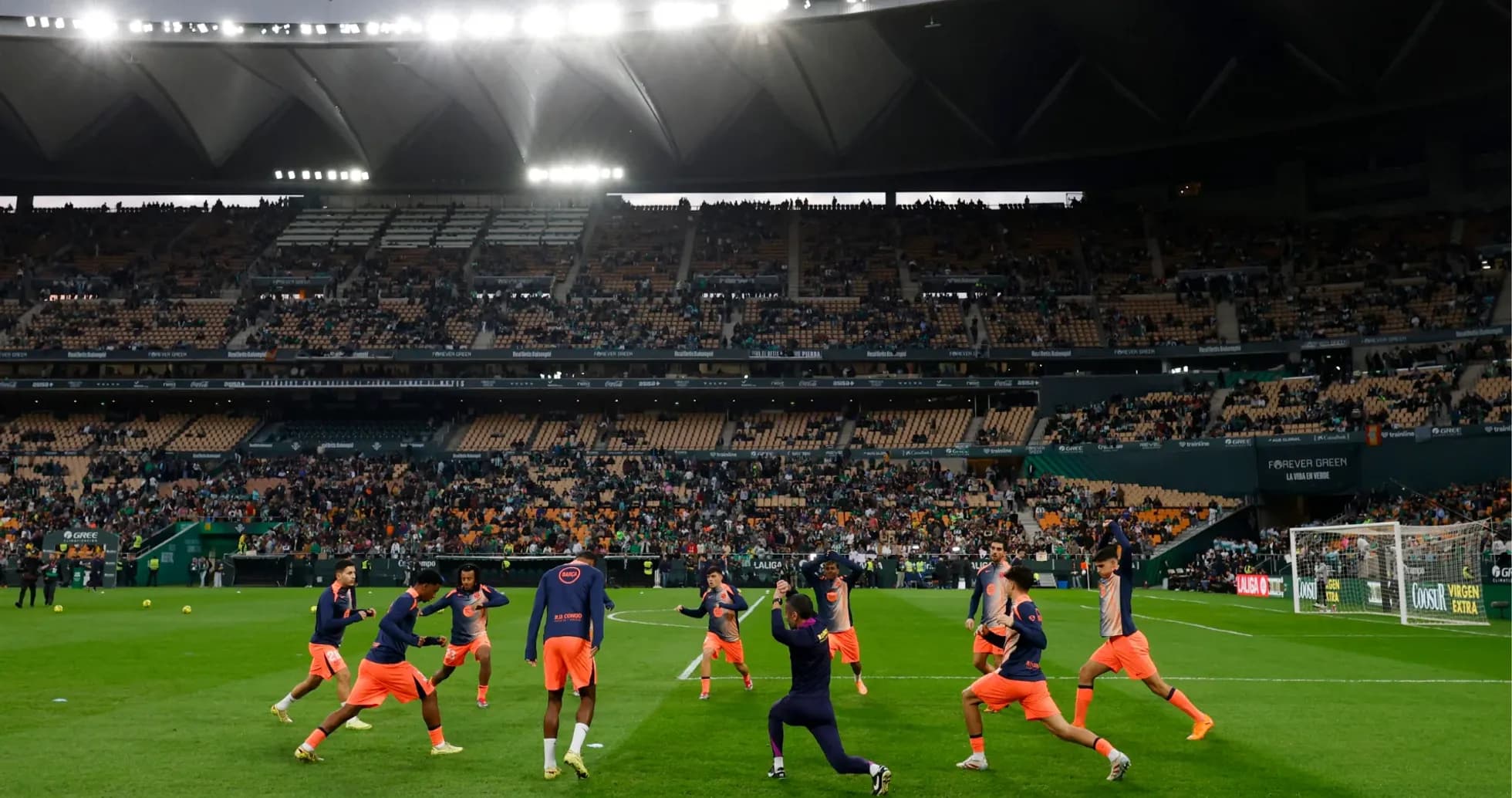 Players warming up before Real Betis vs Elche match