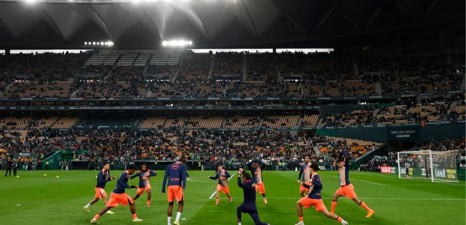 Players warming up before Real Betis vs Elche match