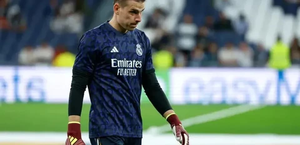 Goalkeeper in Real Madrid kit walking off the pitch
