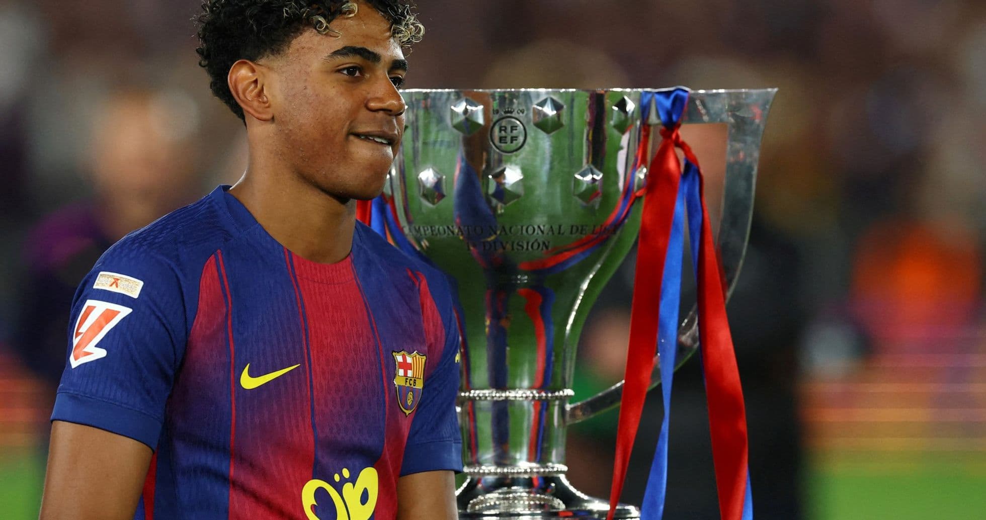 Player celebrating with trophy after match victory