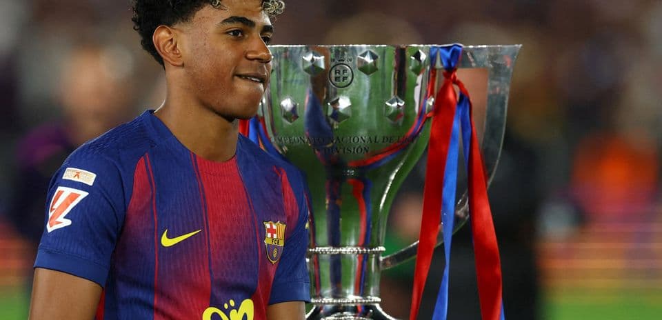 Player celebrating with trophy after match victory