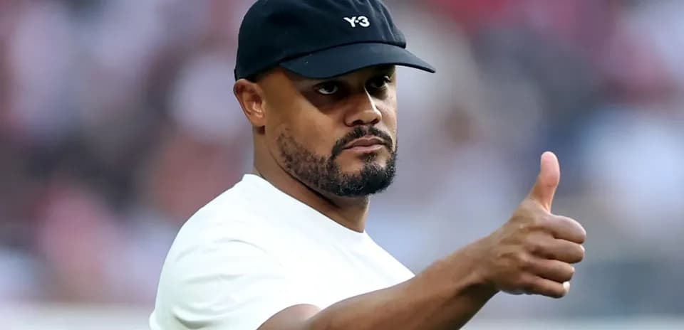 Man in a cap giving a thumbs up gesture