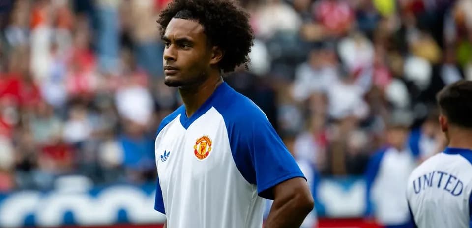 Player in Manchester United training kit on field