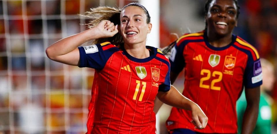 Spain players celebrating after scoring a goal
