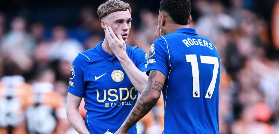 Two players discussing on the pitch after match