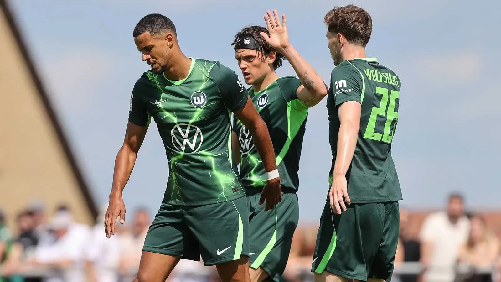 Wolfsburg players celebrating on the pitch