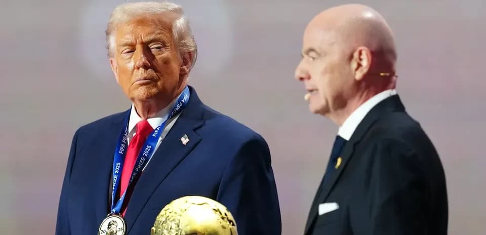 Donald Trump receiving FIFA prize from official