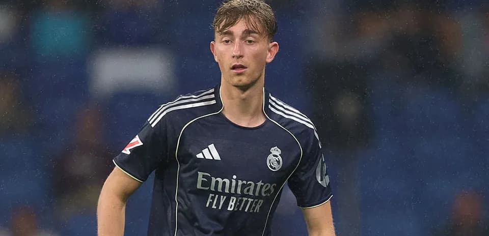Player wearing Real Madrid jersey on the pitch