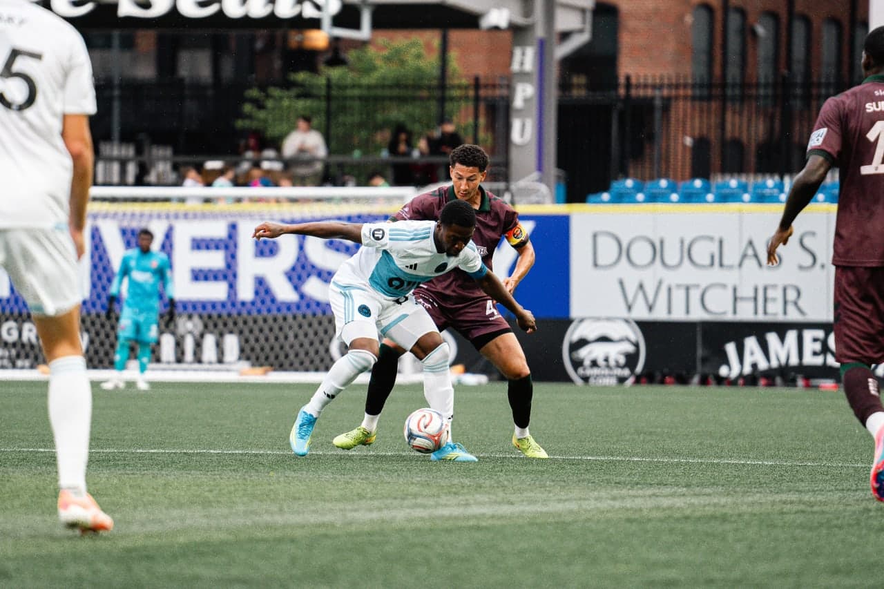 Players battling for the ball during match