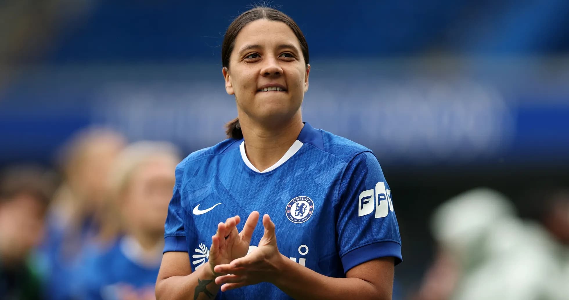 Player applauding while wearing Chelsea kit