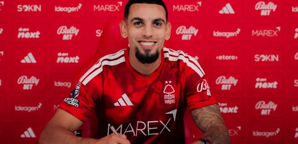 Player signing contract at Nottingham Forest press conference