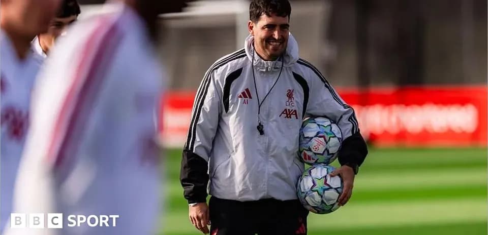Coach holding soccer balls during training session