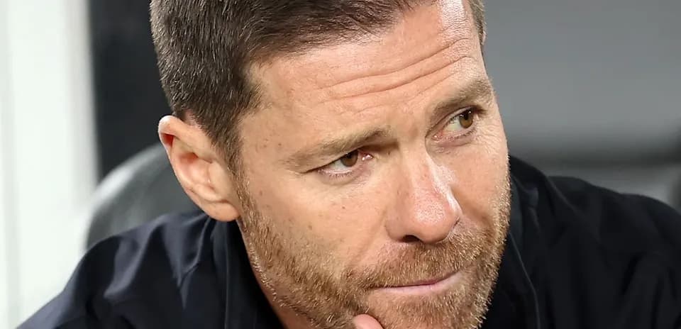 Coach focused during match on the sidelines