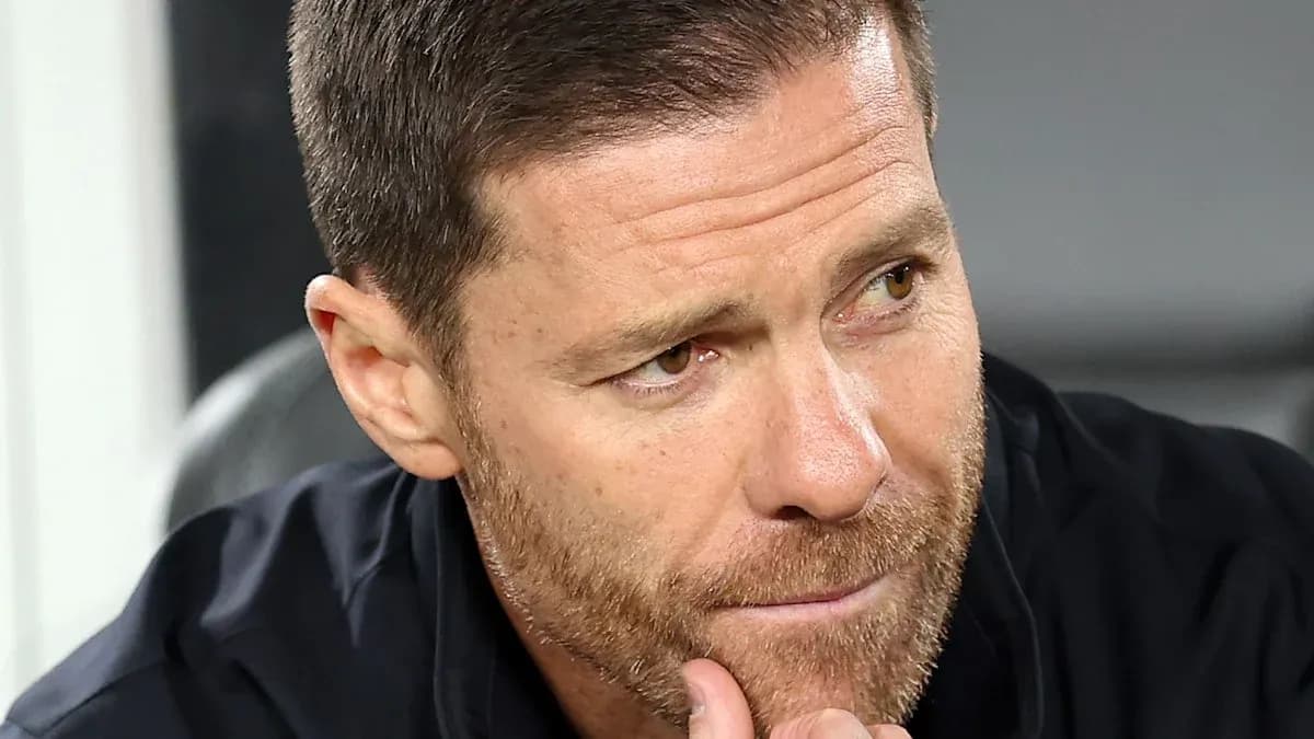 Coach focused during match on the sidelines
