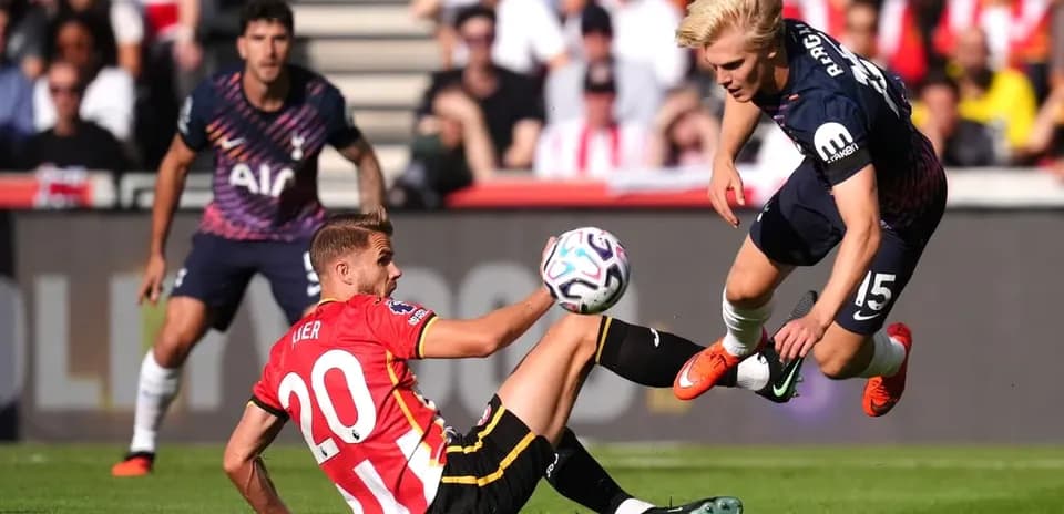 Player tackles opponent while ball is in play