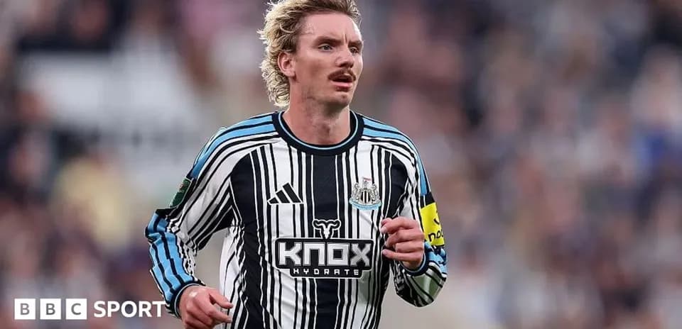 Newcastle player running during a match