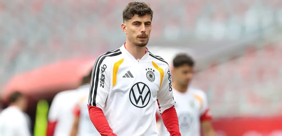 Player in Germany training kit walking on field
