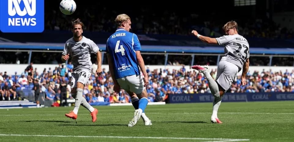 Player kicking ball during a football match