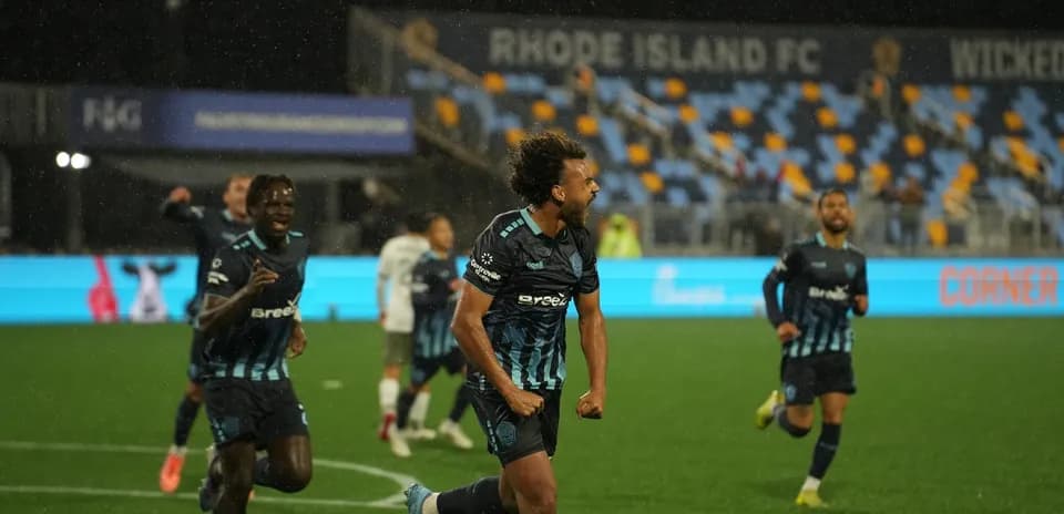 Rhode Island player celebrating goal during match